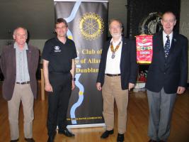 l-r Speaker's Host, Jim Gardner, Kev Mitchell, President Colin Strachan and President Elect Peter Farr with banner from the Rotary Club of Temora.