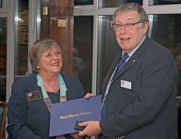 Rotary District Governor Joy Arnott presents John Biggs RCPR President his Paul Harris Fellowship award for his work on the Kop Hill Climb