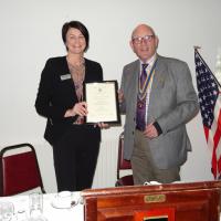 Jo Yates receiving the Wigan Friends of Rotary Certificate to acknowledge the work that Metro Rod do in supporting the work of Wigan Rotary Club in the Community.