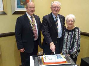 President Mark, Norman and Nancy with the cake.