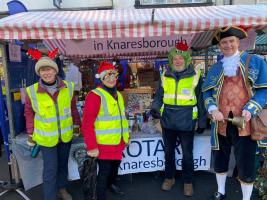 •	Knaresborough Rotarians with their Tombola Stall and the Town Crier