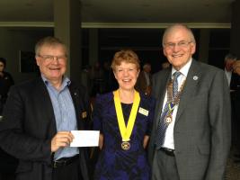 President Chris presents a cheque to Peter Roberts (NSPCC)