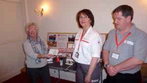 Red Cross volunteers Lyndsey and Eddie with President Marie