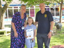 Penelope Barstow being presented with her award from Kinver Rotarian Graham Smith and Headteacher Mrs Natalie Sefton