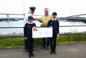Handing over the cheque