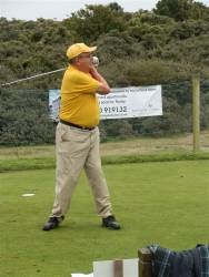 President Neil Smith of the Rotary Club of Burnham Beeches drives off the first Tee