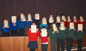 Enthusiastic to the end! Receiving their certificates of participation in the Primary School Quiz 2015  - All Winners!