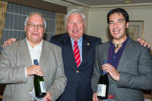 President Hubert Porte presents President Elect Ray Shead and President Nuno Dionisio with a bottle of Paris Quai d'Orsay champagne.