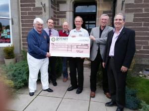 President Jim handing over the Club's cheque for £1,200 raised for Prostate Scotland.