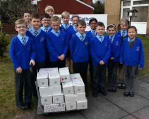 Pupils from St Patrick's Primary School fill 58 shoeboxes for International Aid Trust for Lent.