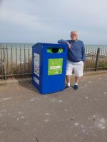 Past president Jim Nicolson shows off one of the many beach re-cycling collection points