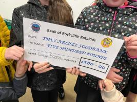 Rockliffe Rotakids presenting their cheque to Carlisle Foodbank