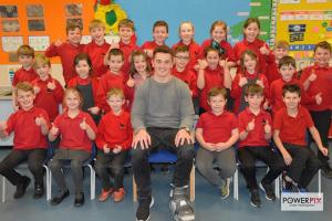 Narberth Junior School 'Rotakids' Club members are pictured with rugby ace Jonathan 'Foxy' Davies