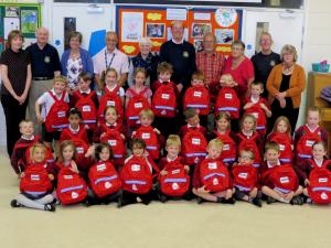 Children and Rotarians packing bags in 2015