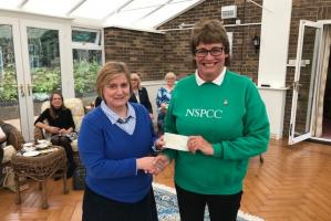 Nichola Bull presents a cheque to Clare Strawson, NSPCC