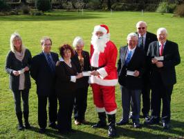 Presentation of money collected at Christmas Sleigh to various charities