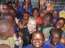 Sylvia Keris with school children in Uganda