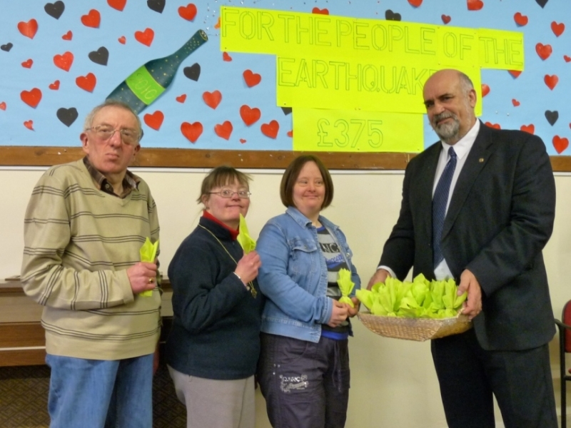 Stephen, Teresa and Joanne hand over the collection bags to President Dave