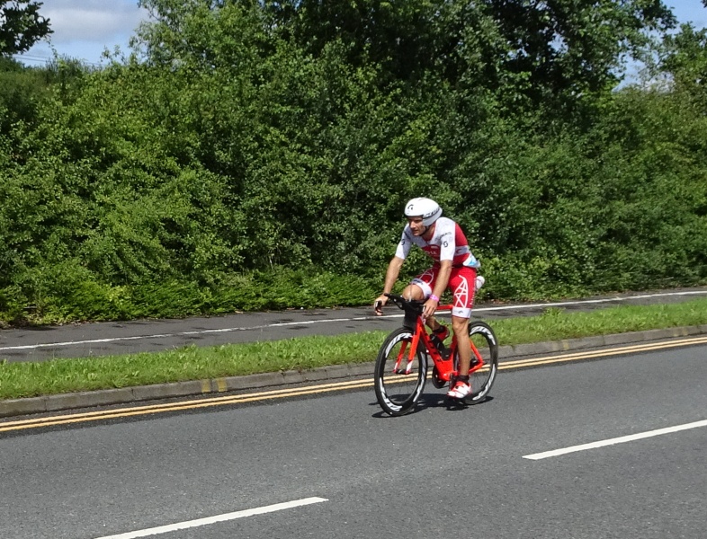 The leading man arrives on his bike.