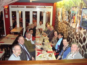 Team at dinner with hosts in Gibraltar