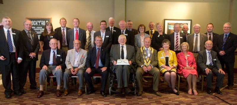 Club members congratulate Joe thomson on 60 years in Rotary