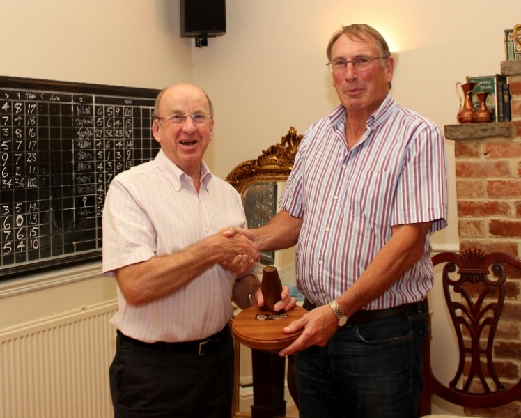 President Ken presents Club Service Chairman Alan with the coveted trophy