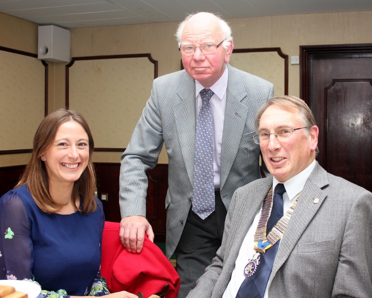 Louise Bird with President Alan (seated) and Rotarian Peter