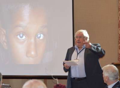 John Miles speaking to the audience on his Eye Project