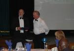 President Andrew welcoming Henry Blowey as an honorary member, in recognition of the support provided to Past DG Margaret during her year in office.