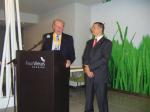 Ron Whitaker Vice President of Woodbridge addressing the guests at the Thursday Dinner with Lourenco translating
