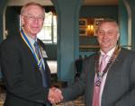 President David Ellis handing the office of President-Elect to Michael Smith