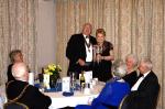 Rotarian Margaret Trevette receiving the President's Cup from Conwy President David Thomas.