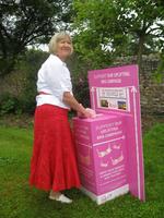 Rtn Chris Bown putting a bra into collection box