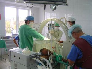 Shows the C-Arm in use