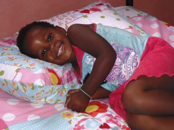 An Kwa Zulu orphan's joy at having a new bed