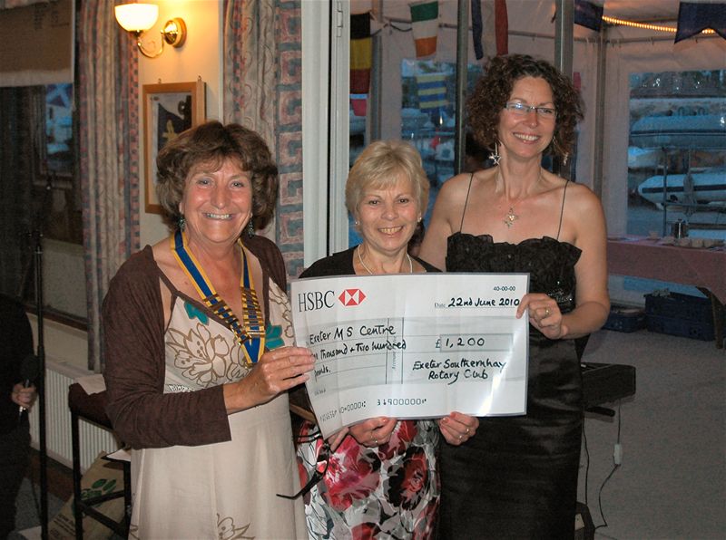 President's Night - President Christine hands over the cheque for fundraising to Caroline of the MS Centre