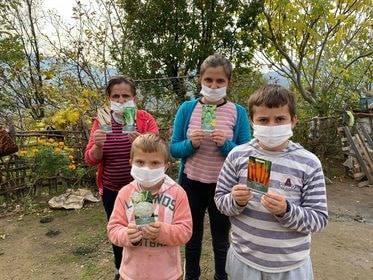 A group of children in Librazhd with the donated seeds for planting. 