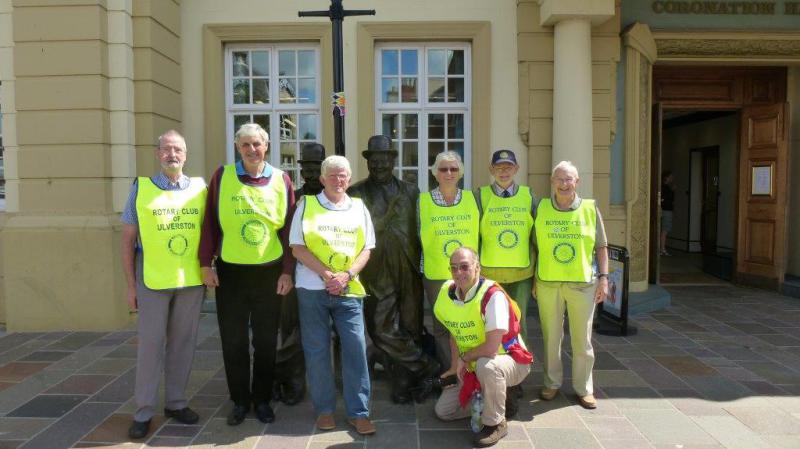 Rotary club volunteer stewards with Laurel and hardy