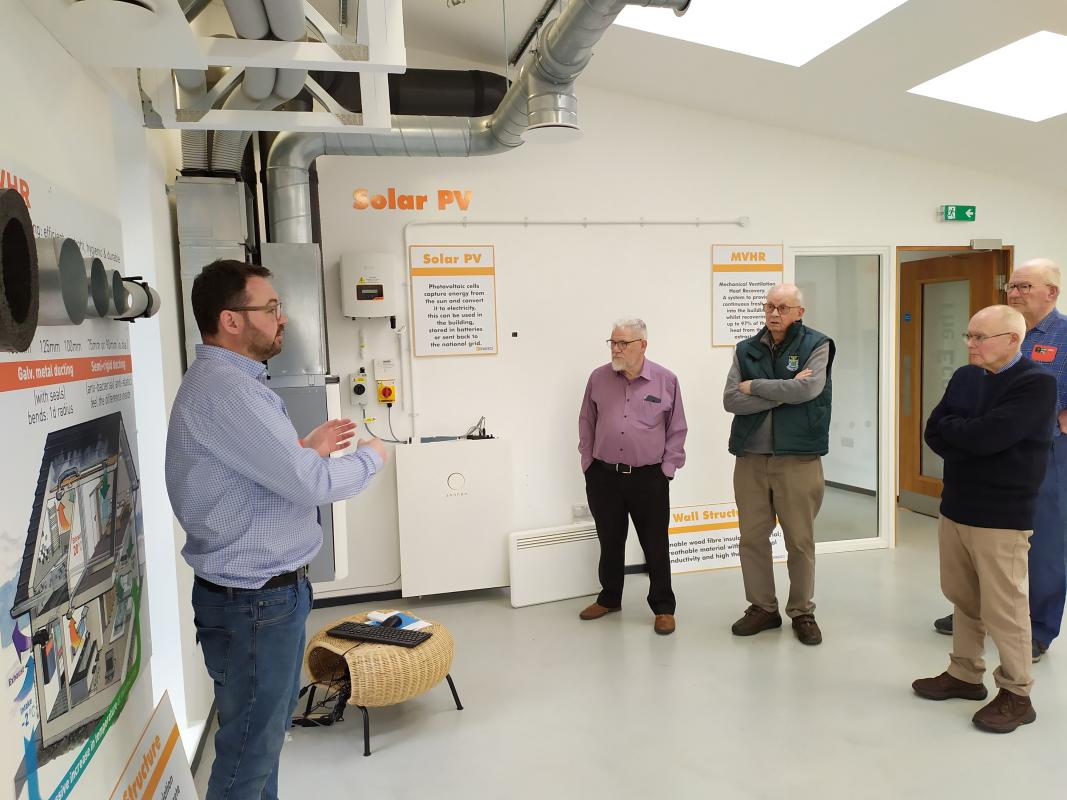 Richard explains heat technology to some members of the Rotary team