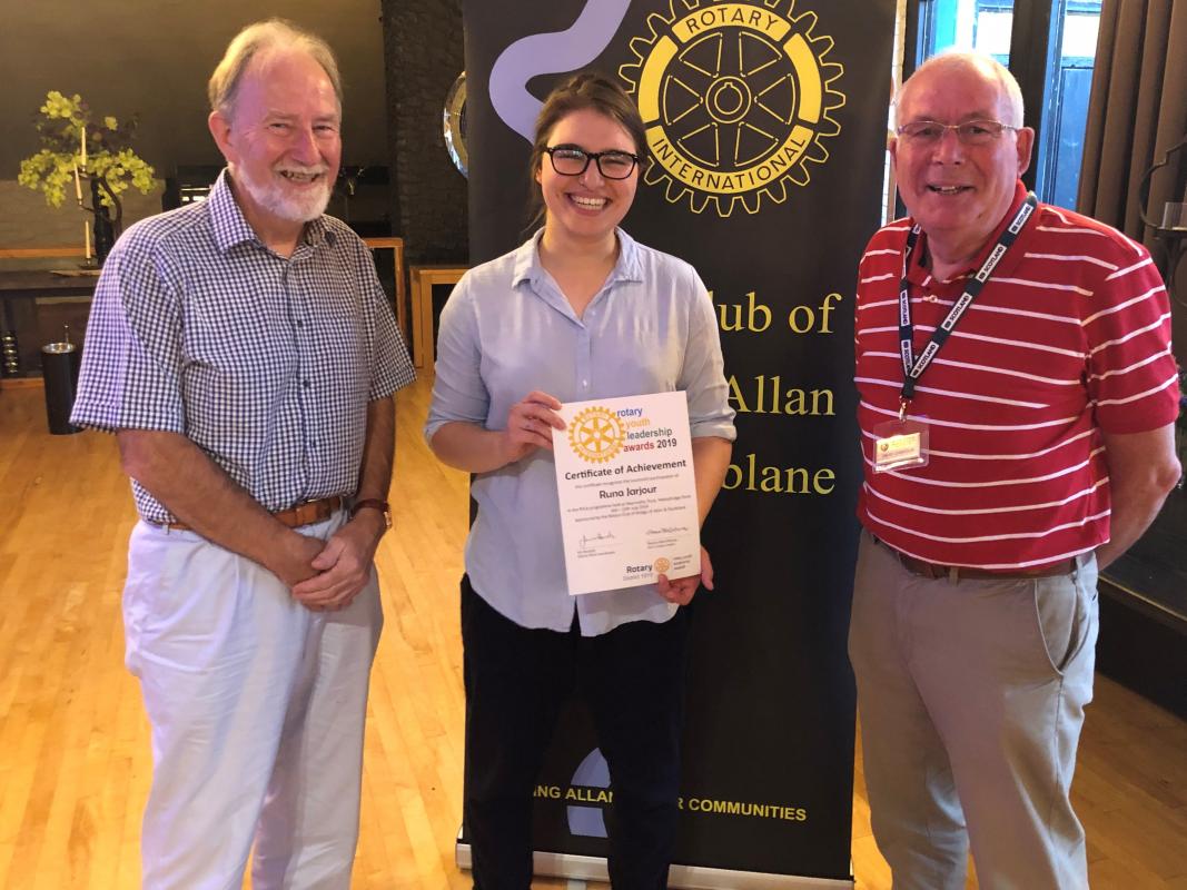 Runa Jarjour receiving her RYLA Certificate from Colin Strachan, left with President elect David Chisholm