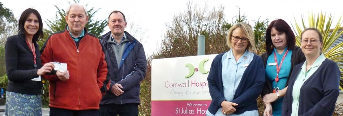 President Laurie Forde hands over £1,500 at St Julia's Hospice, Hayle.