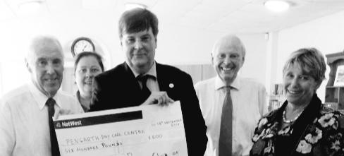 Penzance Rotary President Matt Martens presents funds to Pengarth Trustee Eric Parton.