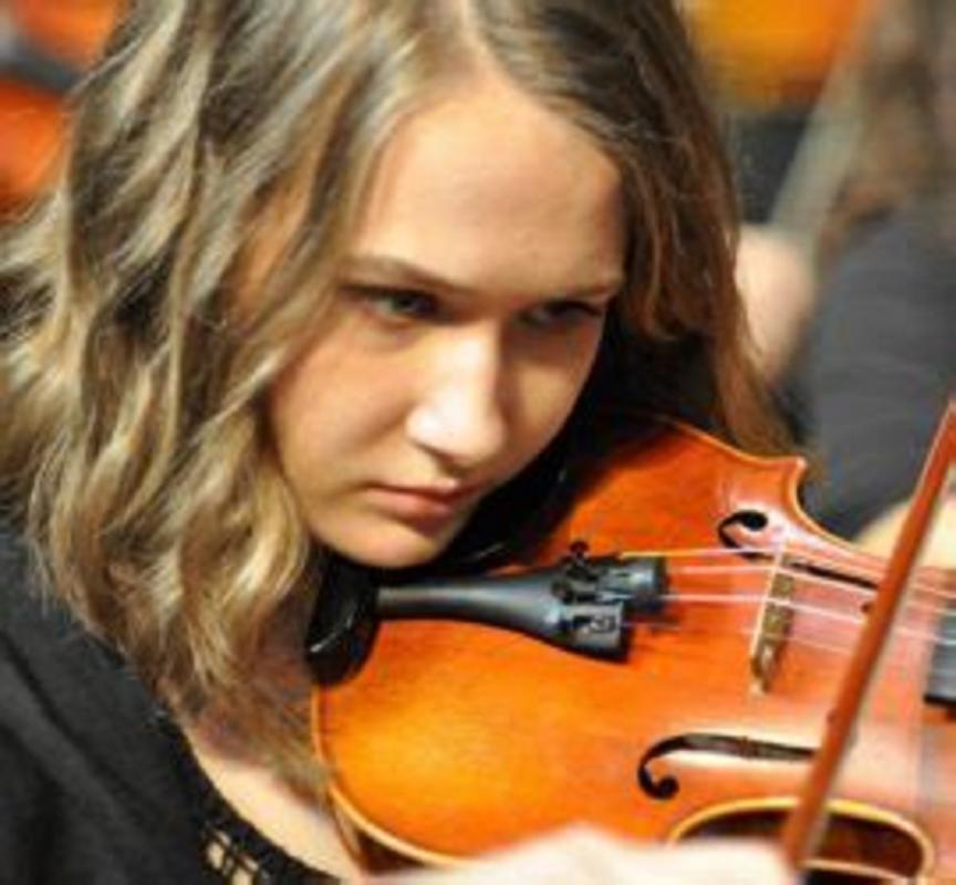 Young musician at the concert