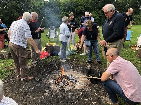 Rotarian's cooking their desserts at a recent meeting