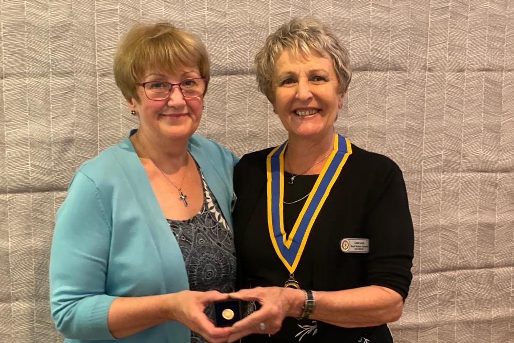 Gill with President Linda and her award