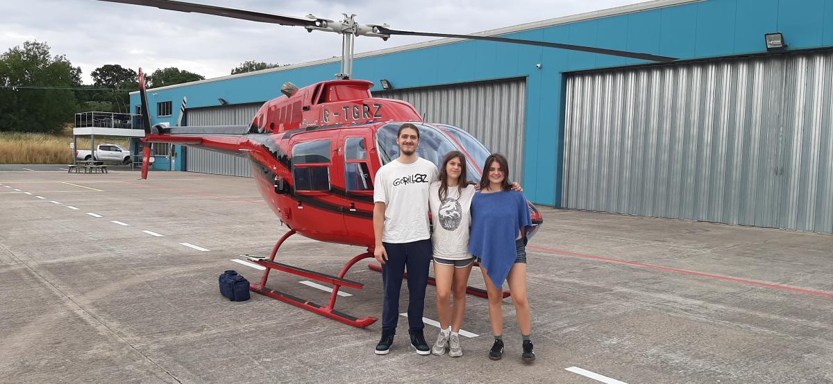 Rossbeerfest’s 2025 Charity Raffle 1 st Prize of a one hour Helicopter Flight was won by
Joshua Evans of Ross-on-Wye. Joshua elected to have his two sisters, Evie & Phoebe, with
him on the flight in a Bell Jetranger B206, G-TGRZ, owned by Tiger h