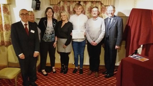 Ioan Minshull, his parents, representatives from Denbigh High School with President Kevin and Rotarian Gwilym Williams 