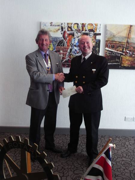 President Nigel presenting a cheque to Tony Jewitt.
