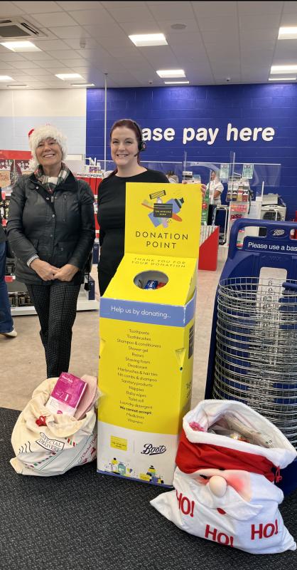 Vice President Annita Small presented two sackfuls of Hygiene Items to Hazel at the Boots Collection Point at the Warwickshire retail Park.