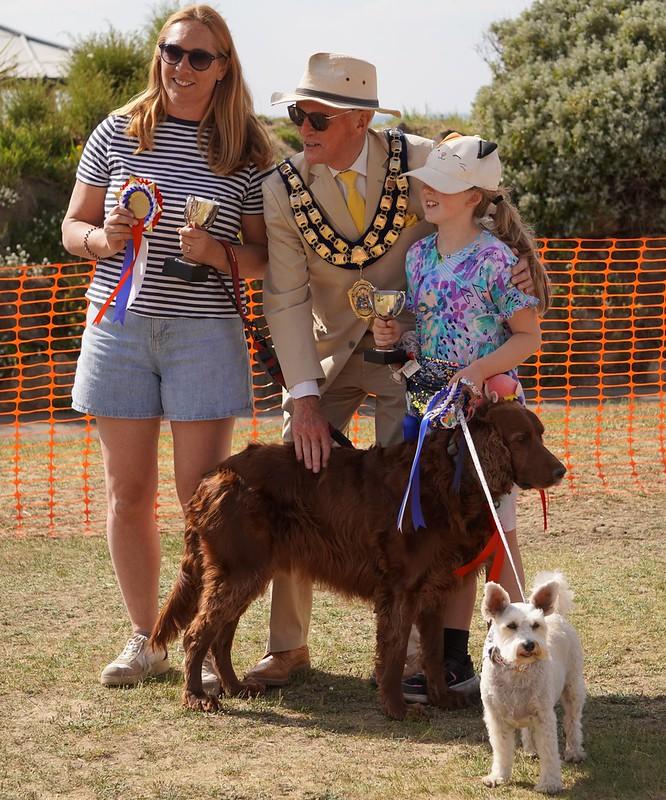 Best in Show and Best Child handler with their trophies presented by John Crockford-Hawley.